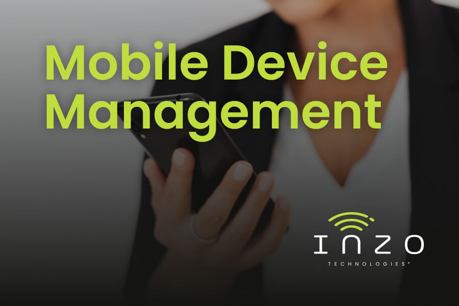 Blog graphic titled “Mobile Device Management” over a darkened photo of an individual holding a cellphone.